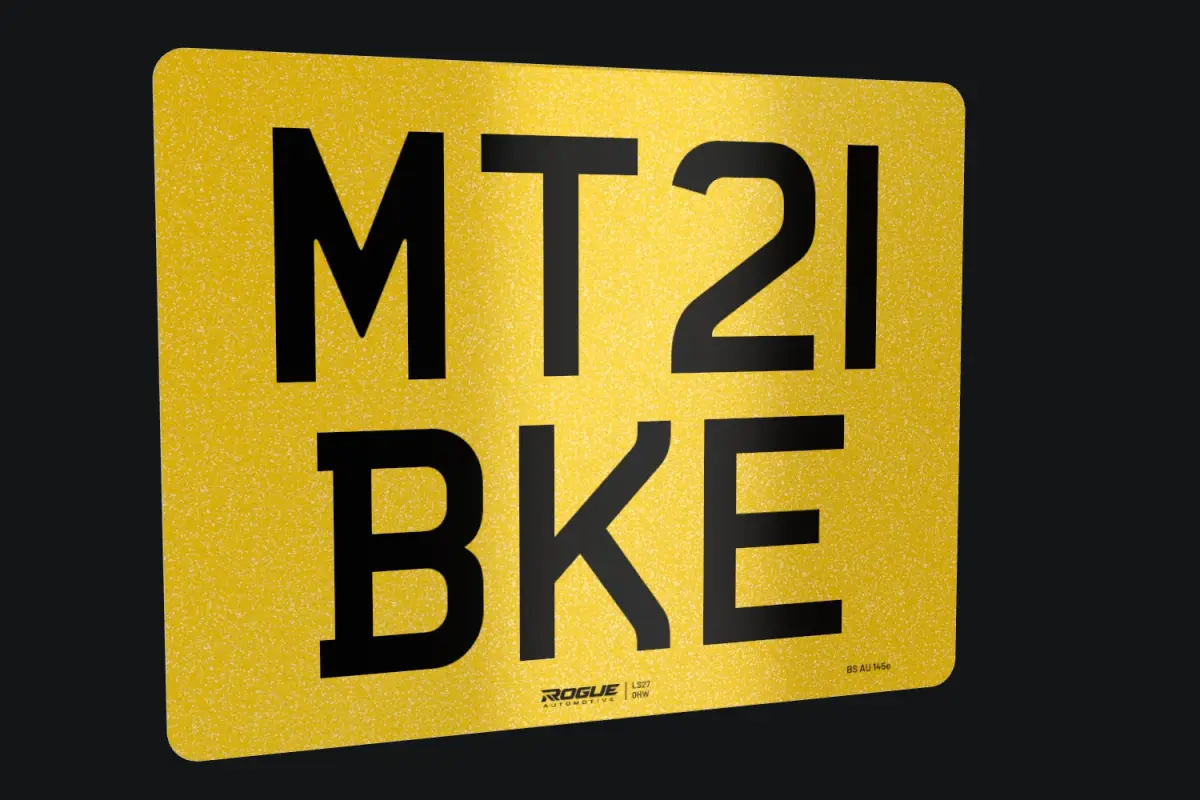 Printed yellow 9 × 7 inch motorcycle number plate with the registration on two lines