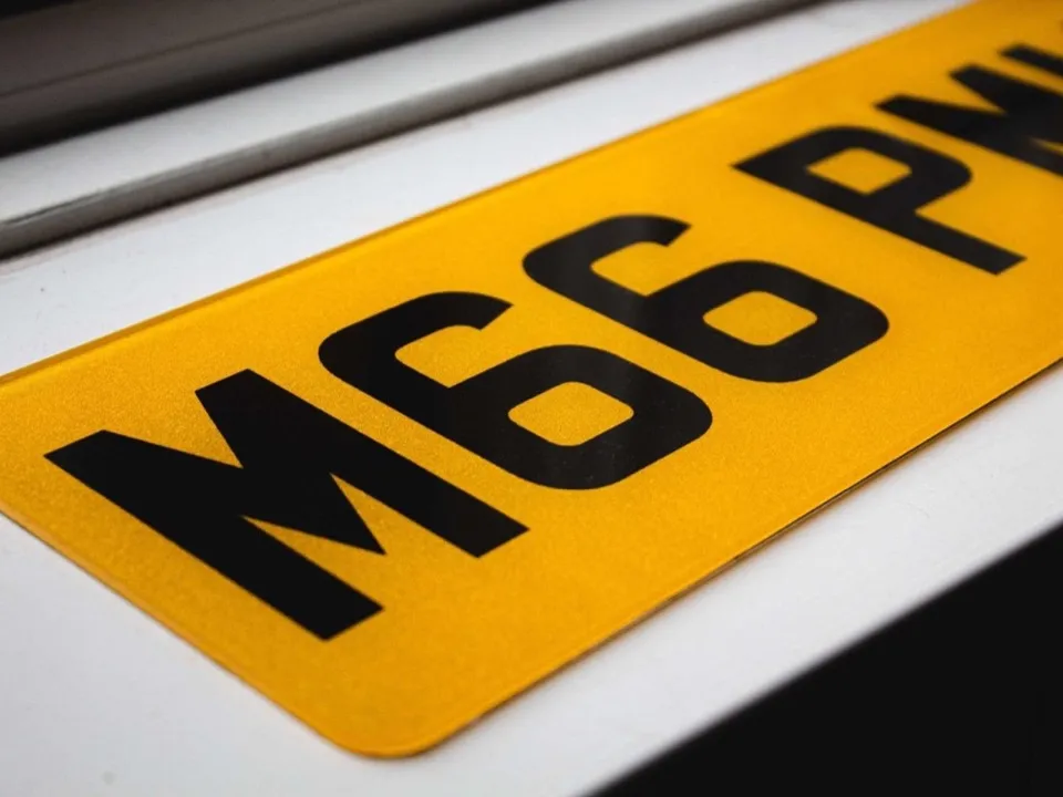Printed yellow rear number plate